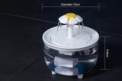 Pet water fountain with floral design on a dark background