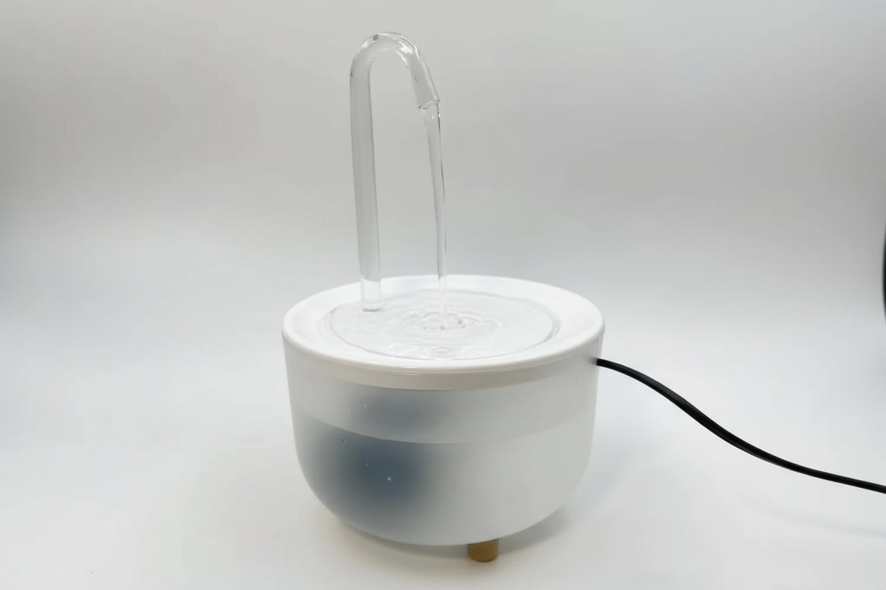 White ceramic incense burner with a clear glass chimney on a white background