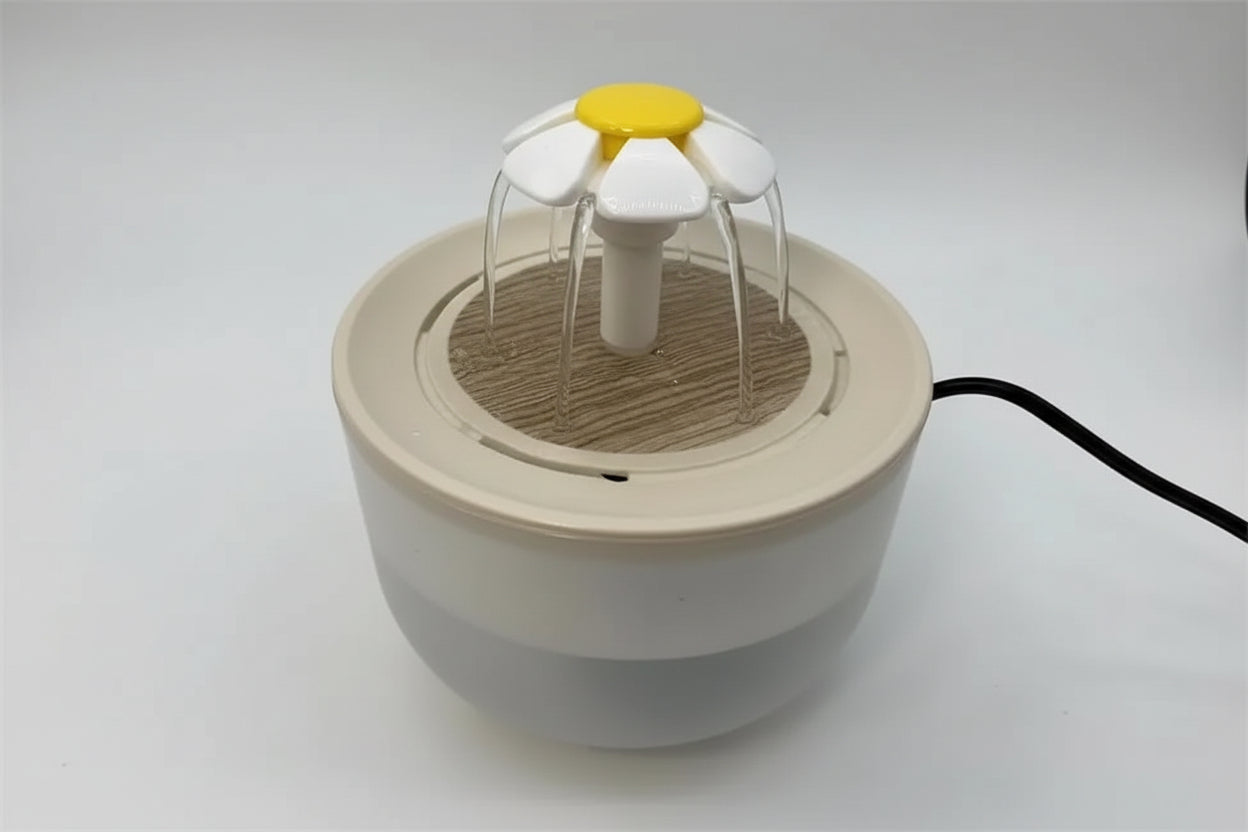 Small white and yellow device resembling a flower on a white background